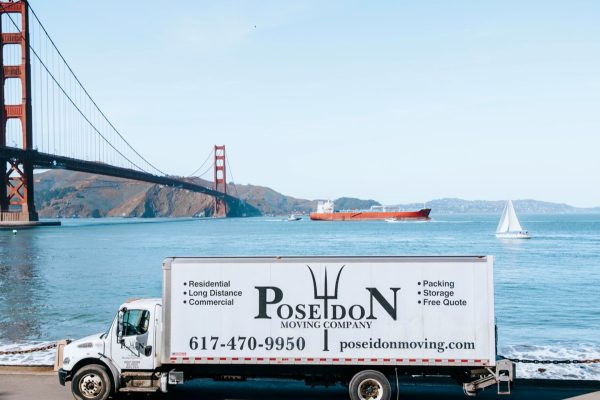 Moving truck in San Francisco with Golden Gates Bridge