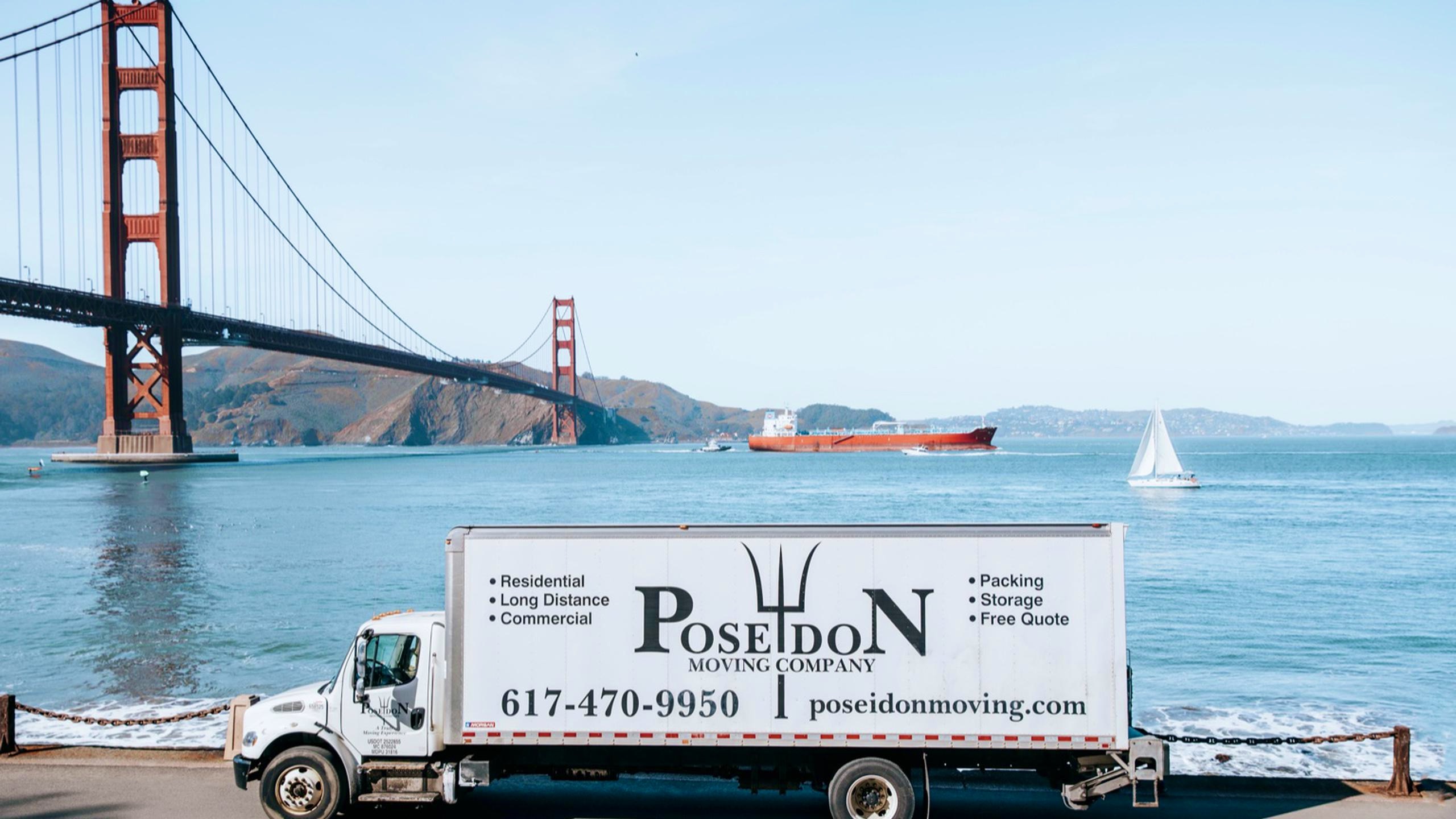 Moving truck in San Francisco with Golden Gates Bridge