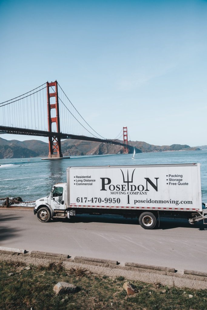 Poseidon Moving truck showcasing coast-to-coast long-distance moving services for Boston residents.