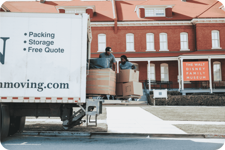 Poseidon Moving team loading boxes into a moving truck