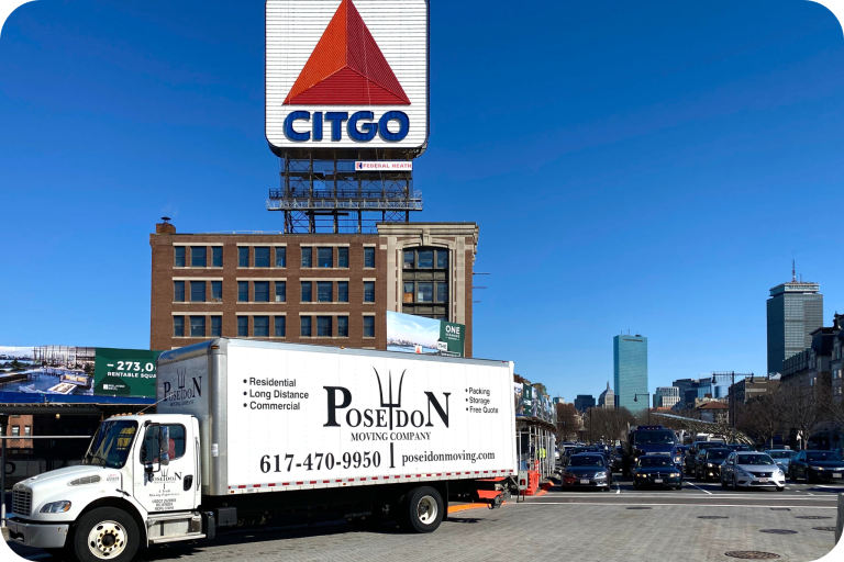 Poseidon Moving truck near Citgo sign in Boston, preparing for long-distance move to New York City