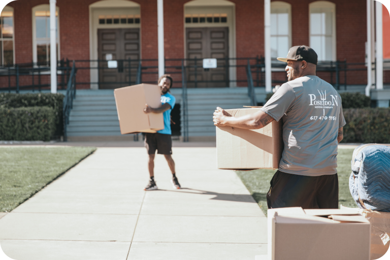 Poseidon Moving Company team carrying boxes during a move on a sunny day.