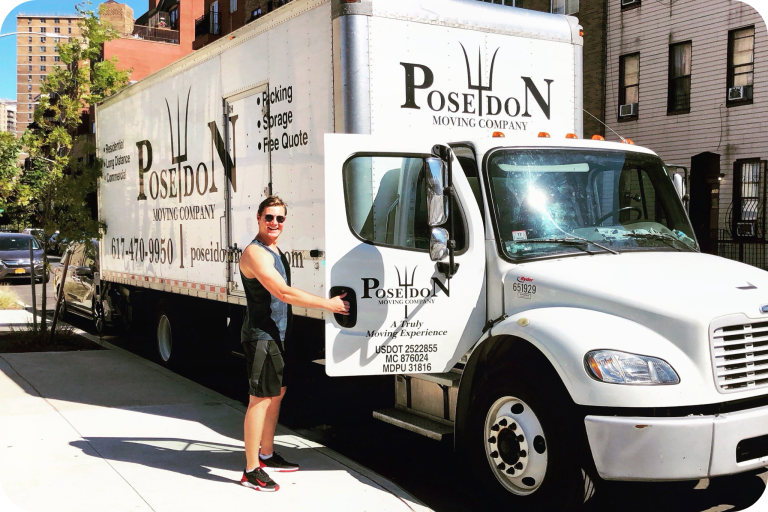 Poseidon Moving foreman standing beside branded moving truck on a city sidewalk